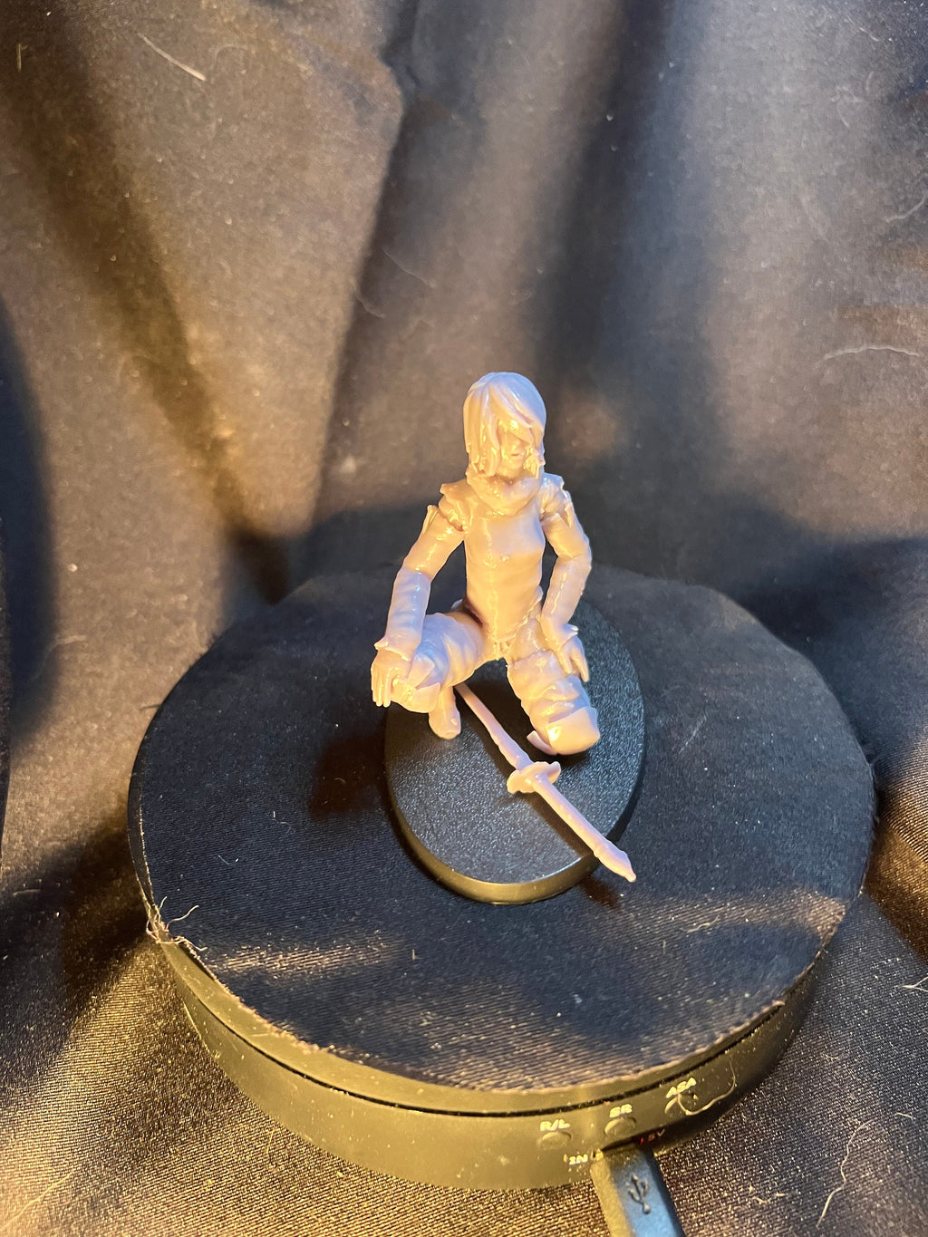 Kneeling Woman Warrior with a Sword