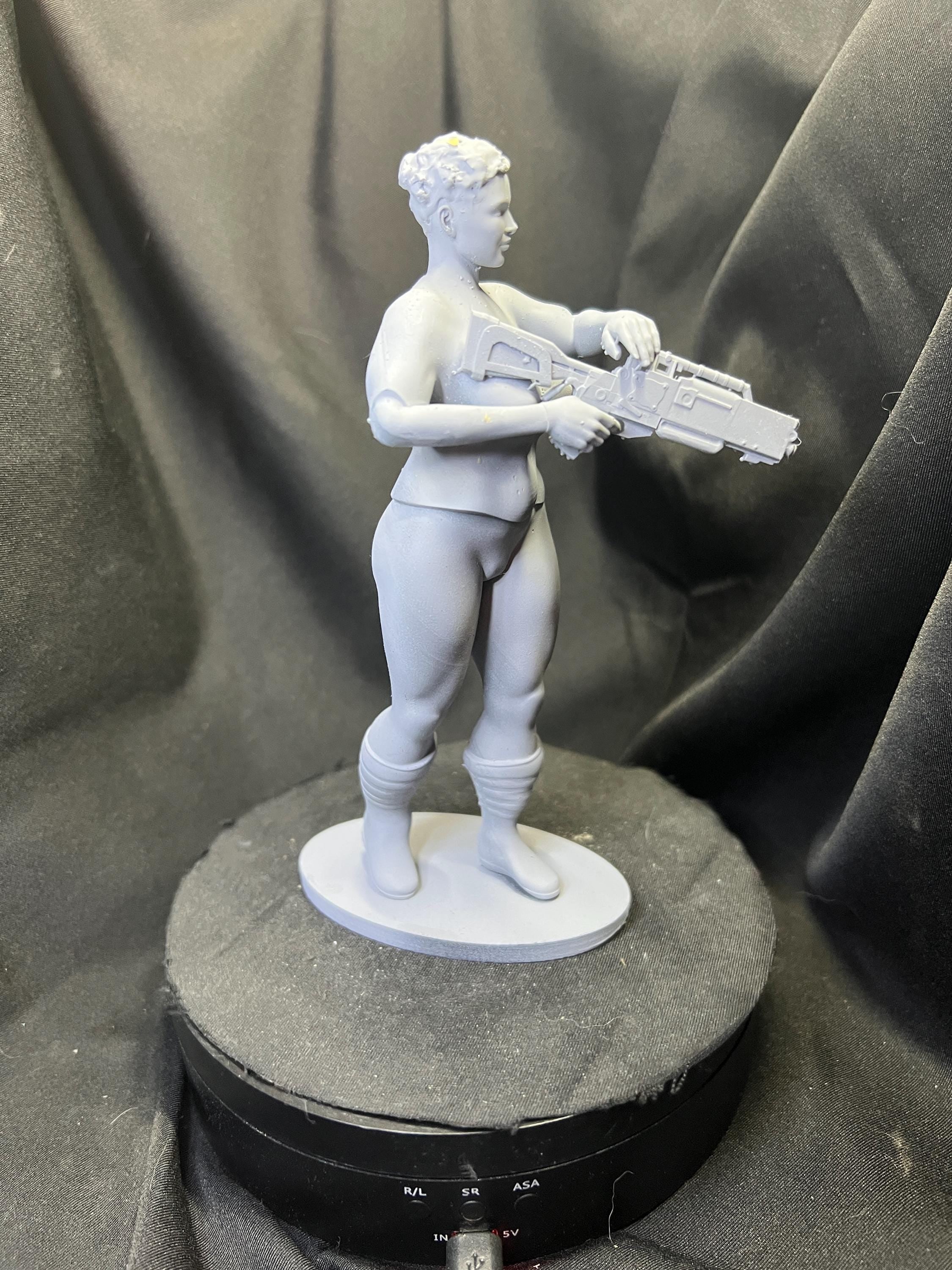 Futuristic Fighter Woman with Blaster Rifle
