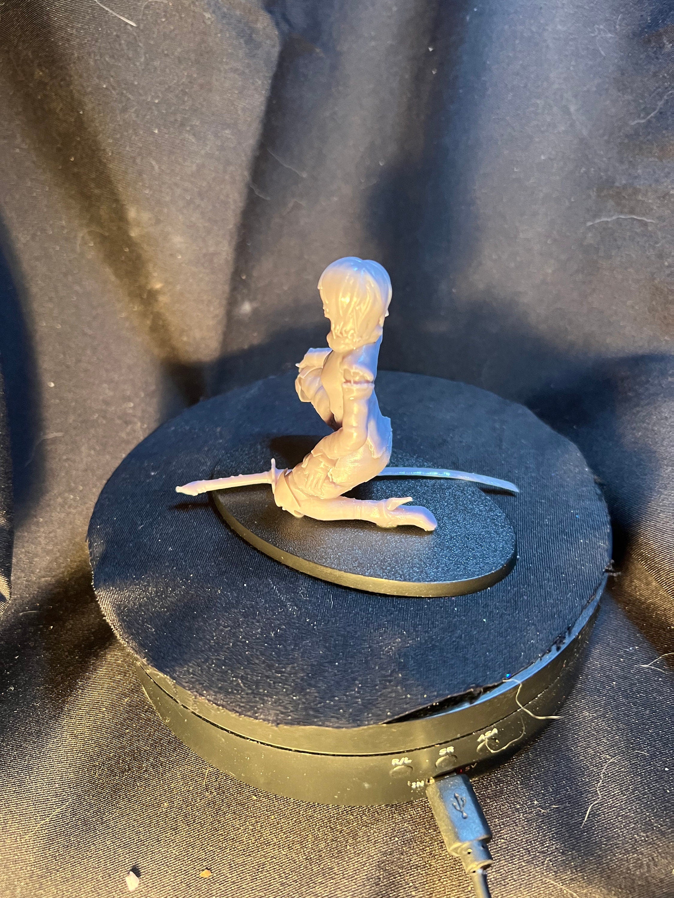 Kneeling Woman Warrior with a Sword