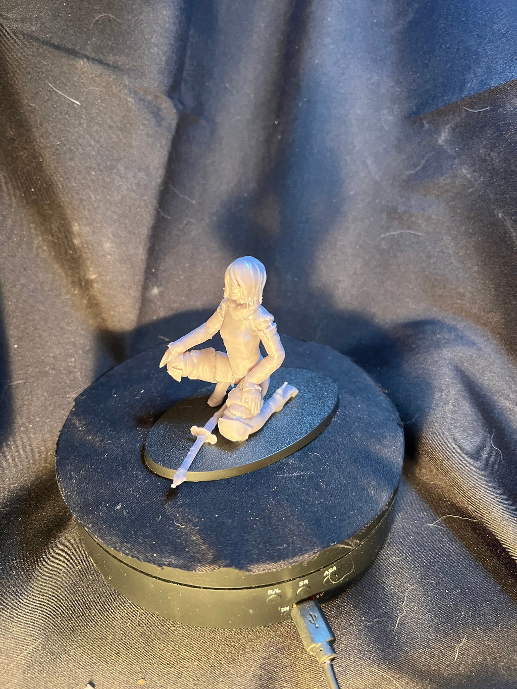Kneeling Woman Warrior with a Sword