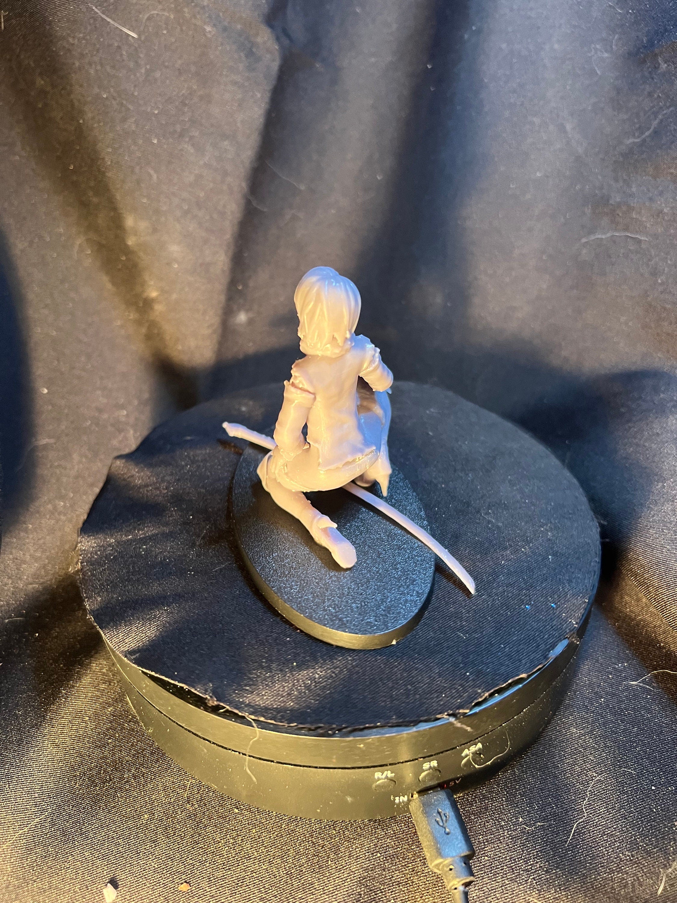 Kneeling Woman Warrior with a Sword