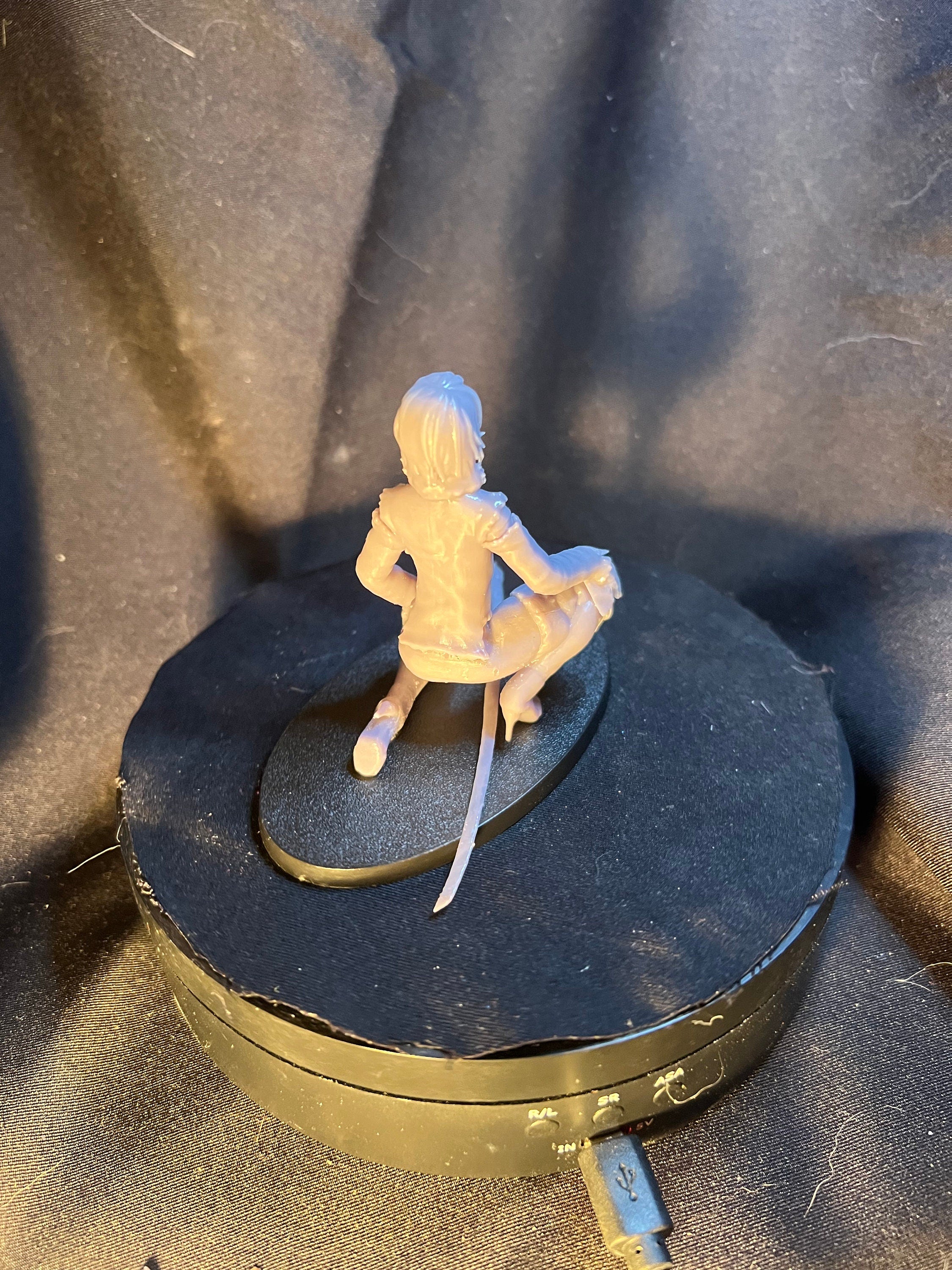 Kneeling Woman Warrior with a Sword
