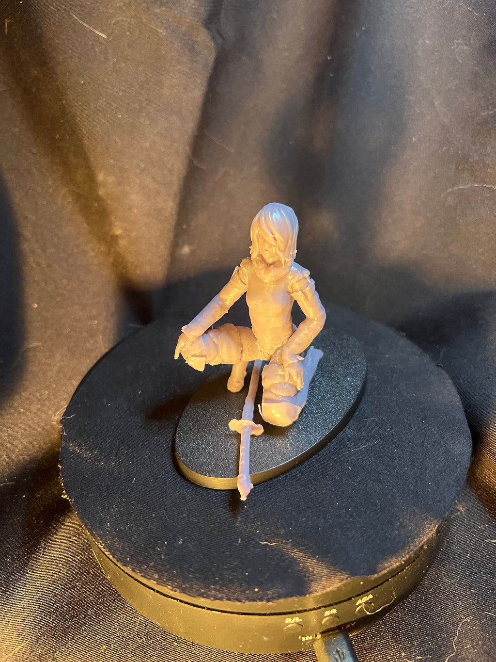 Kneeling Woman Warrior with a Sword