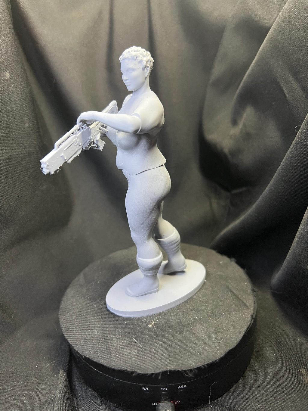 Futuristic Fighter Woman with Blaster Rifle