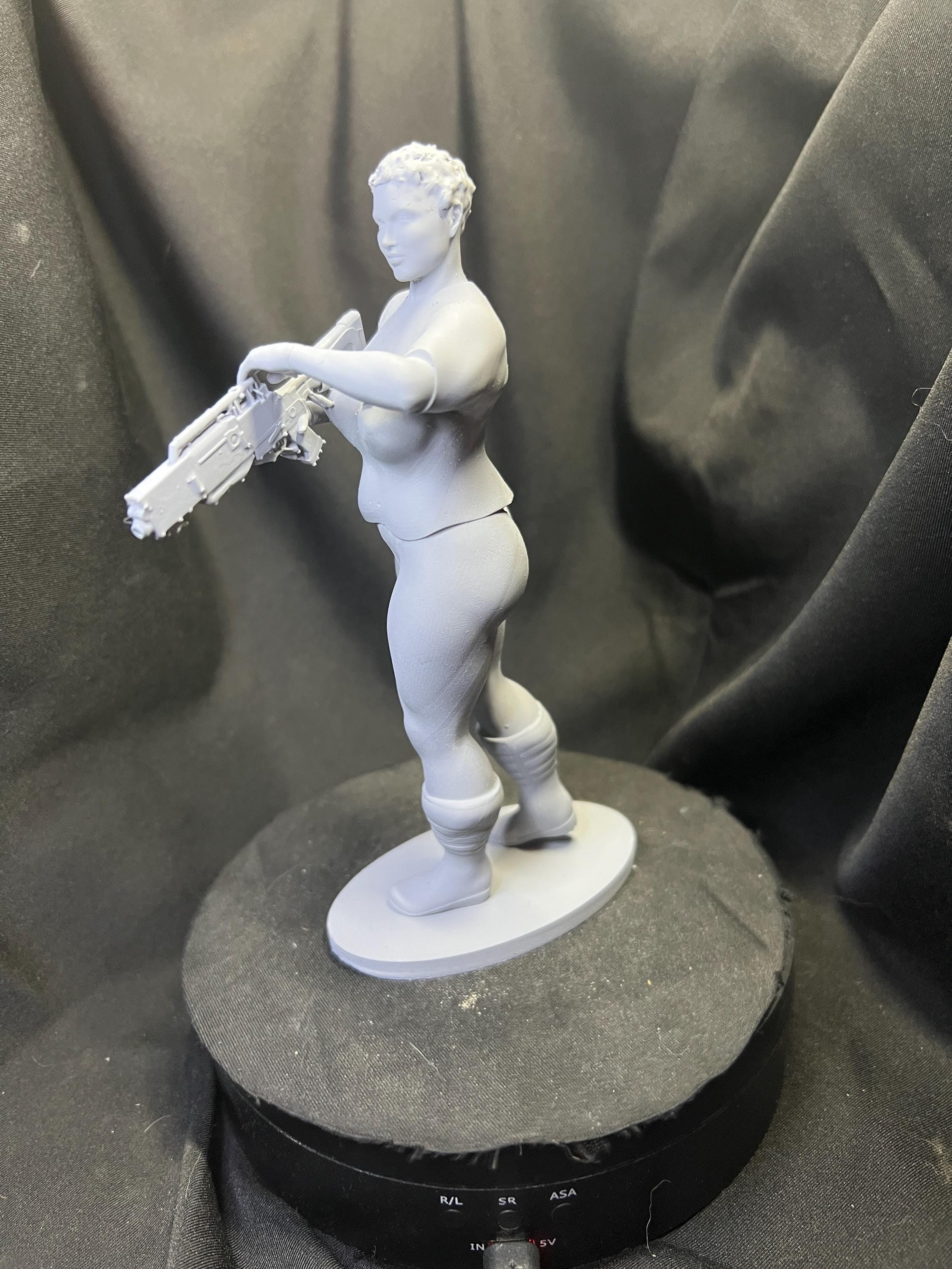 Futuristic Fighter Woman with Blaster Rifle